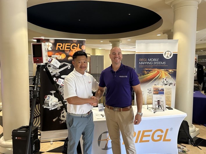 RIEGL USA’s Sr. Business Development Manager Tan Nguyen with McKim & Creed’s National Director of Business Development and Geospatial Services Matt LaLuzerne during the 2025 Topodot User Conference